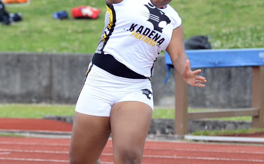 Kadena's Nikeria Albritton puts the shot during Saturday's Okinawa track and field meet. Albritton won with a throw of 10.10 meters.