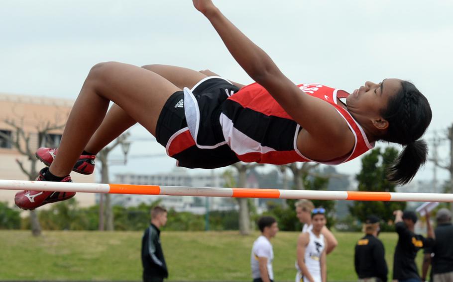 Okinawa Christian's Tia Calvin clears the bar during during Saturday's Okinawa track and field meet. Calvin won the event in 4 feet, 9 inches.