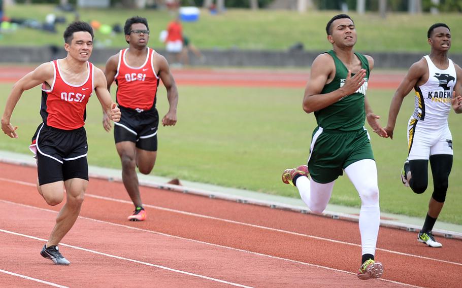 Kubasaki's John Joseph, second from right, leads the pack toward the finish of the 200 during Saturday's Okinawa track and field meet. Joseph won in 23.93 seconds.