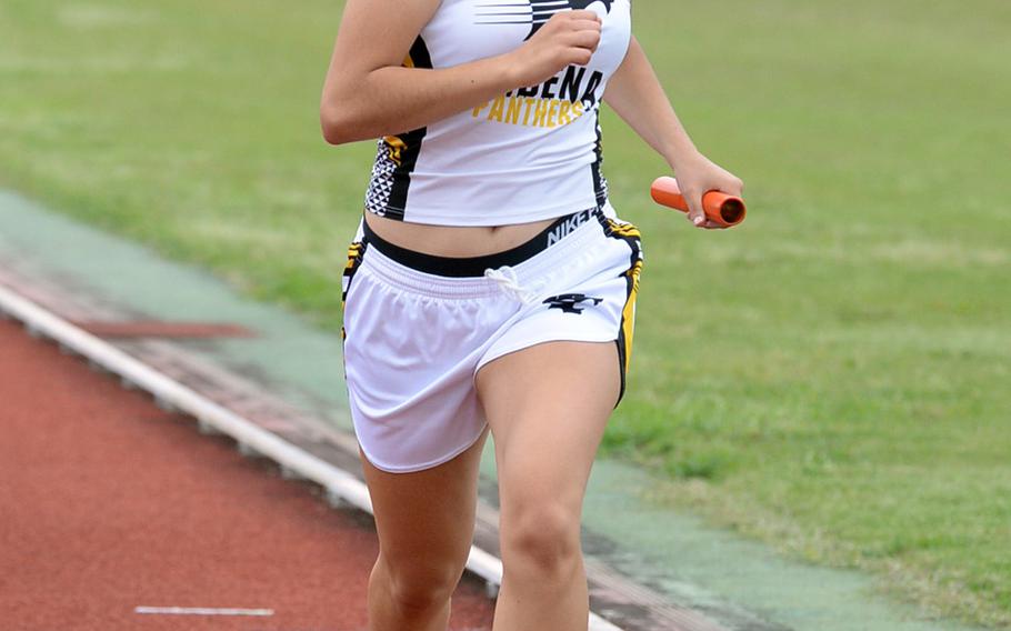 Kadena's Lydia Bills runs the anchor leg of the 3,200 relay during Saturday's Okinawa track and field meet. Kadena won the event in 10 minutes, 33.44 seconds.