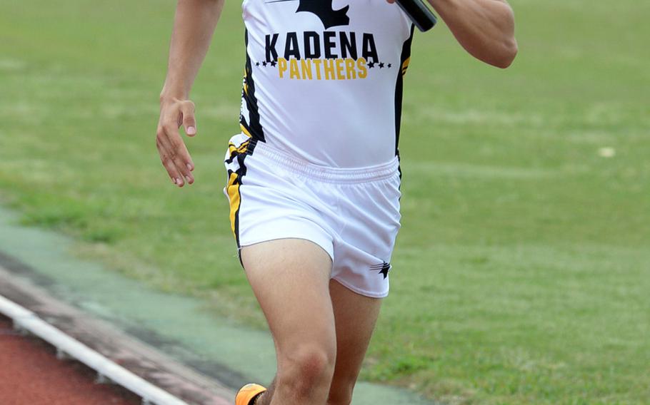 Kadena's Hayden Bills runs the anchor leg of the 3,200 relay during Saturday's Okinawa track and field meet. Kadena won the event in 8 minutes, 52.10 secons.