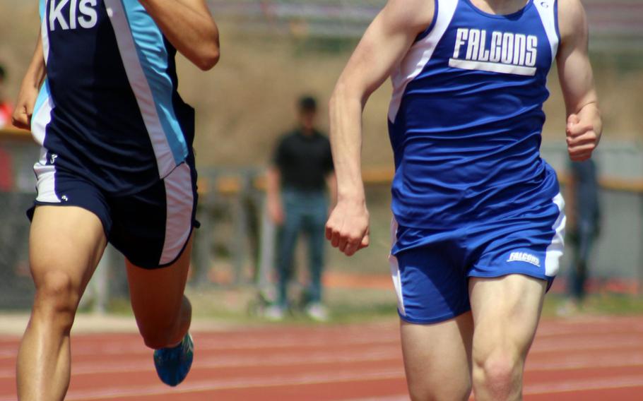 Korea International's Patrick Seong and Seoul American's Jack Newton pound for the finish of the 1,600 during Saturday's track and field meet. Newton, the Far East cross-country runner-up, edged Seong by .05 seconds, 4:49.58-4:49.63.