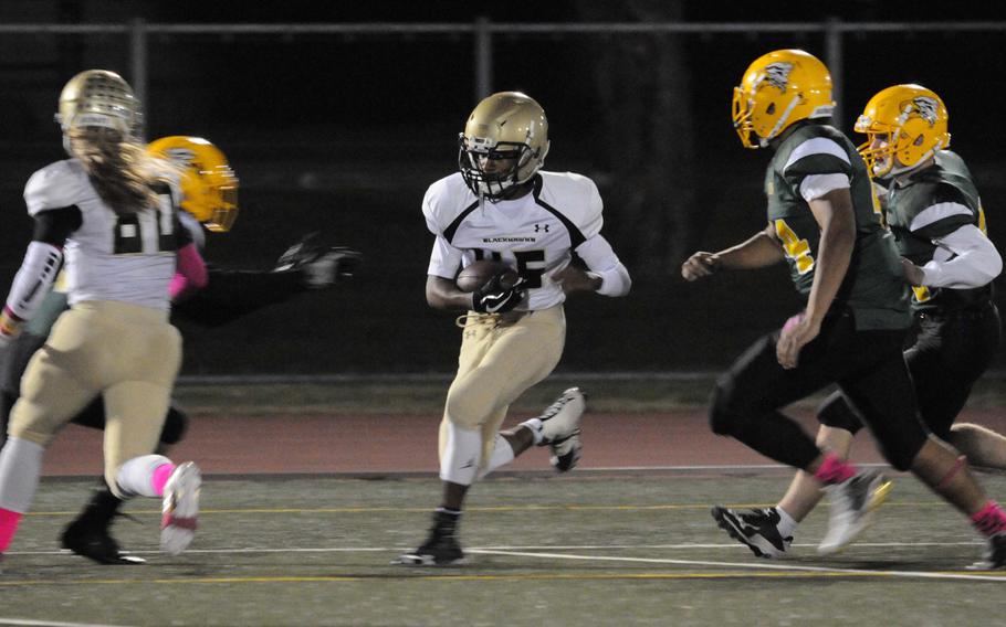Humphreys' Sh'voda Gregory Jr.works his way past teammate Owen Williams and Robert D. Edgren pursuers upfield.
