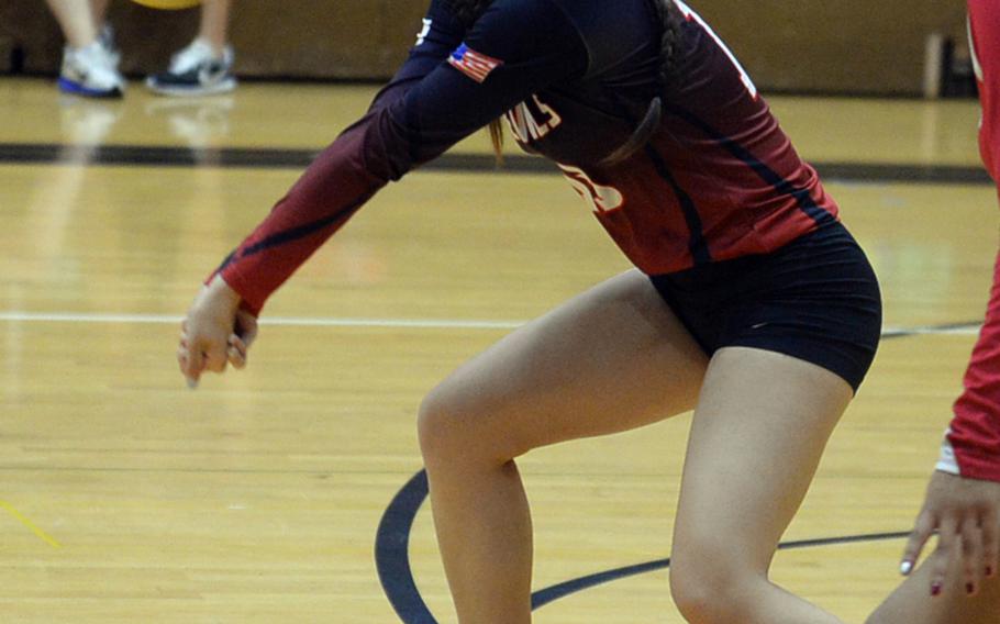 Nile C. Kinnick's Kiana Porter digs up a serve against Stanford American International School of Singapore during Thursday's American School In Japan YUJO III Tournament pool-play match. The Red Devils swept the Lions 25-10, 27-25.