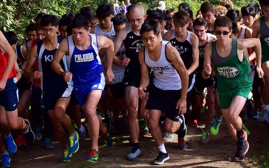 The boys pack takes off at the start of Saturday's Korean-American Interscholastic Activities Conference final regular-season race at Camp Humphreys. Tucker Chase of Seoul American, third from left, won in 17 minutes, 52 seconds.