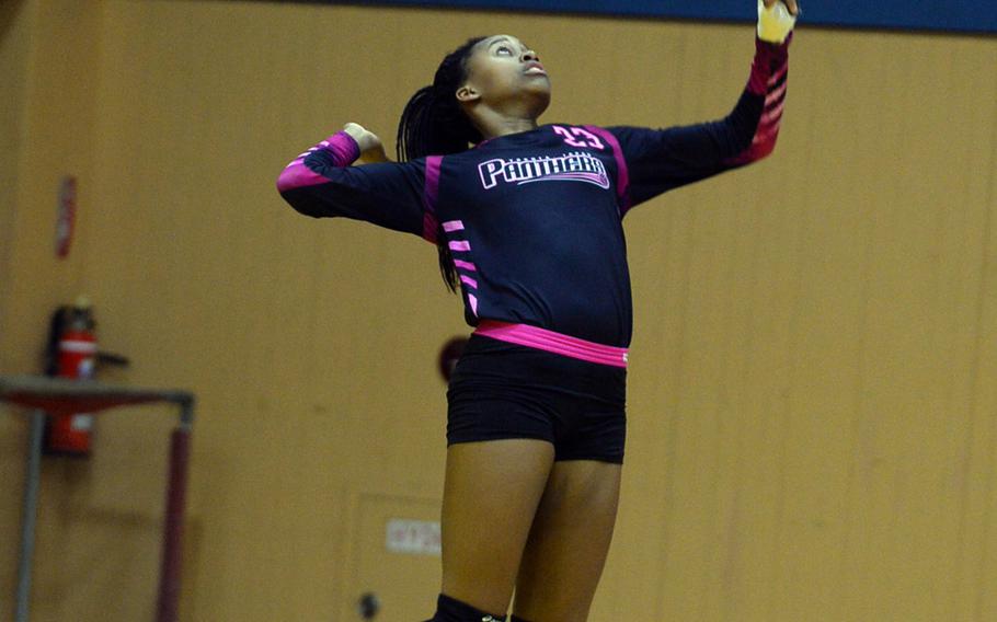 Senior Britney Bailey jump serves for Yokota against American School In Japan during Wednesday's volleyball match, won by the Mustangs 25-15, 25-19, 28-26.