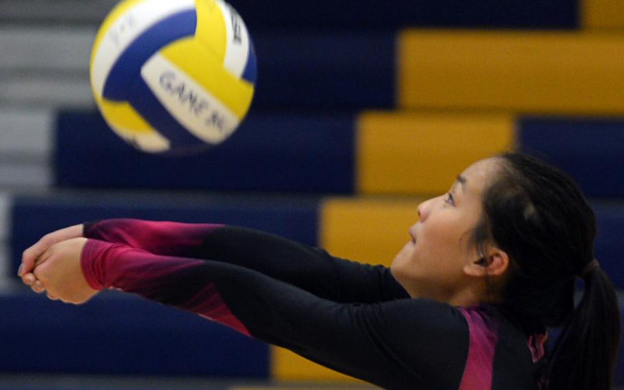 Yokota senior Lianna Bloom bumps the ball against Christian Academy Japan during Tuesday's volleyball match. The Panthers rallied from 2-1 down to beat the Knights 25-17, 21-25, 21-25, 25-14, 15-8 in a rematch of last season's Far East Division II final.