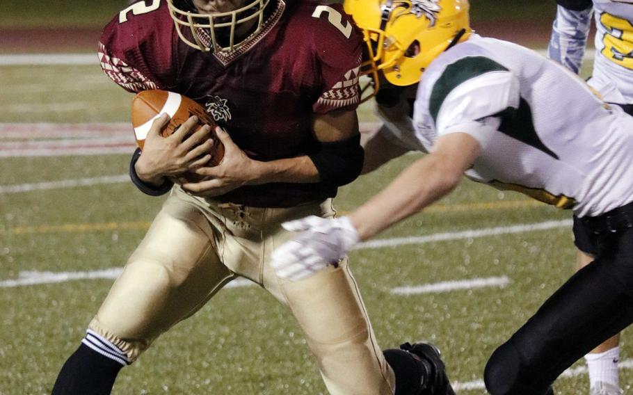 Matthew C. Perry's Dylan Ernst eludes a Robert D. Edgren tackler. He had a touchdown run and an interception.