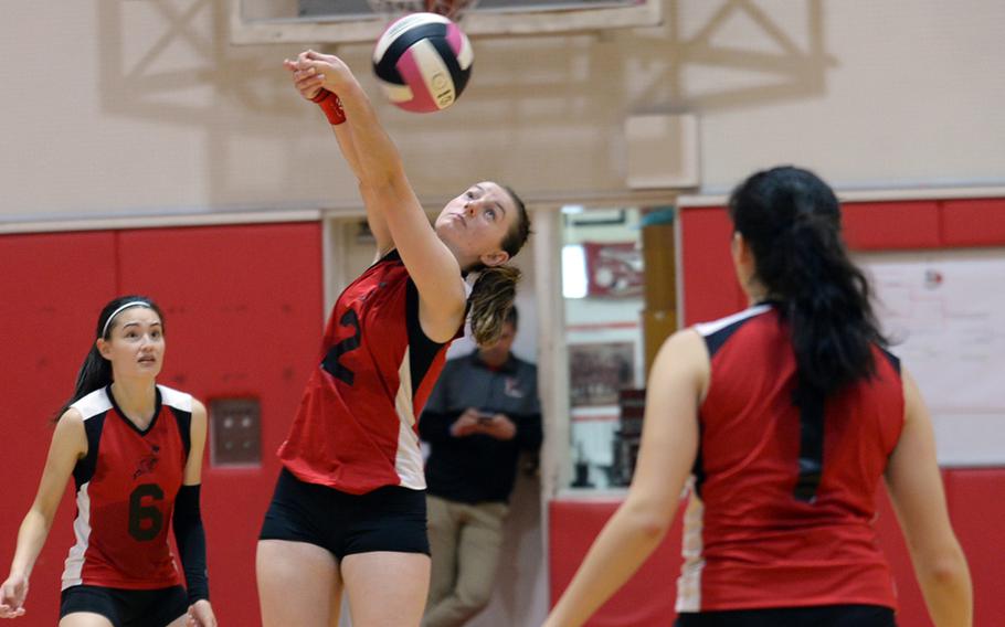E.J. King's Natalie Schulz bumps the ball over the net against Robert D. Edgren during Friday's DODEA-Japan/Pac-East girls volleyball tournament knockout match, won by the Cobras 25-22, 25-20, 25-22. King advanced to Saturday's elimination match against Zama, needing two wins to reach the final.
