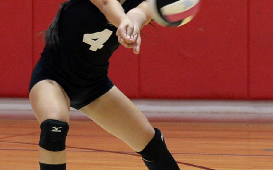 Zama libero Darianne Sanchez digs up a Matthew C. Perry spike during Friday's DODEA-Japan/Pac-East volleyball tournament knockout match, won by the Trojans 25-18, 25-23, 25-19. Zama moved on to play E.J. King in Saturday's first knockout match, needing two wins to reach the final.