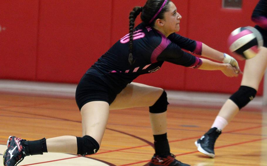Yokota's Adrianna Diaz lunges to dig a Nile C. Kinnick spike.