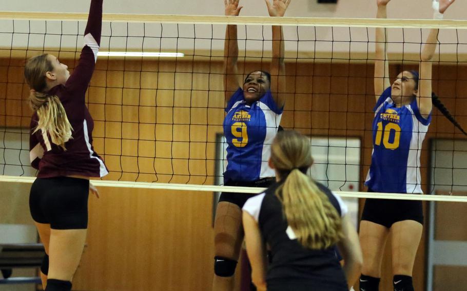 Matthew C. Perry's Maddie Swieczkowski sends a spike over the double block of Yokota's Kyra Anderson and Adrianna Diaz during Wednesday's Division II volleyball pool-play match. The defending champion Panthers beat the Samurai 25-17, 25-11.