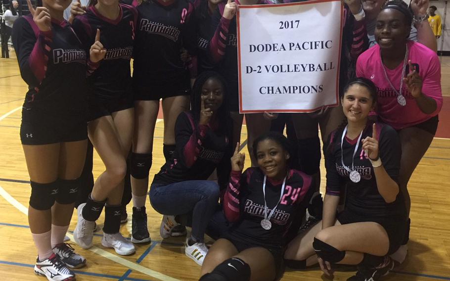 Yokota poses with the banner.