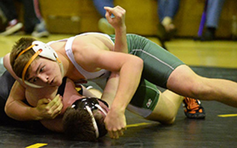 Kubasaki's Oakley Mueller torques Kadena's Max Wedekind's shoulders toward the mat in the 168-pound bout during Wednesday's Okinawa wrestling dual meet. Mueller won by technical fall 10-0 in 2 minutes, 27 seconds, and the Dragons won the meet 53-7.
