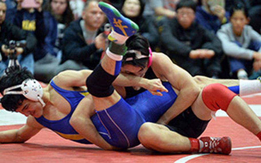 Nile C. Kinnick's Lucas Wirth gets control of St. Mary's Rio Lemkuil in the 129-pound final of Saturday's 25th Kinnick Invitational "Beast of the Far East" Wrestling Tournament. Wirth won by technical fall 12-2 in 3 minutes, 31 seconds in a battle of former two-time Far East champions.