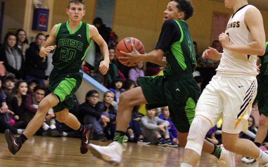 Kubasaki's Tristan Higginson drives upcourt against host American School In Japan during Thursday's pool-play game in the 2nd Kanto Classic Basketball Tournament. The host Mustangs downed the Dragons 62-42.