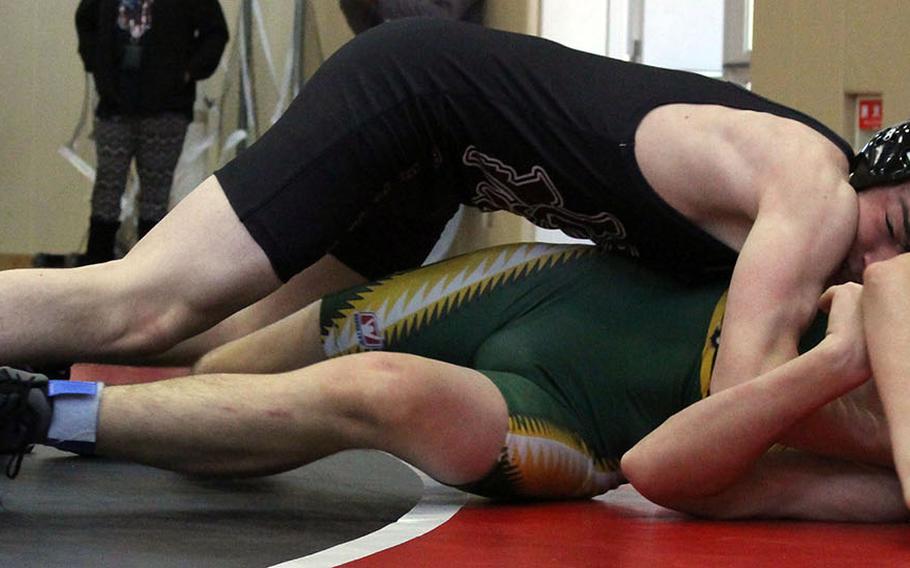 Matthew C. Perry's Brad Ponsiano takes charge of Robert D. Edgren's Drew Swenson in the lightweight class final during Saturday's Perry Invitational Wrestling Tournament. Ponsiano won the bout and the weight class.