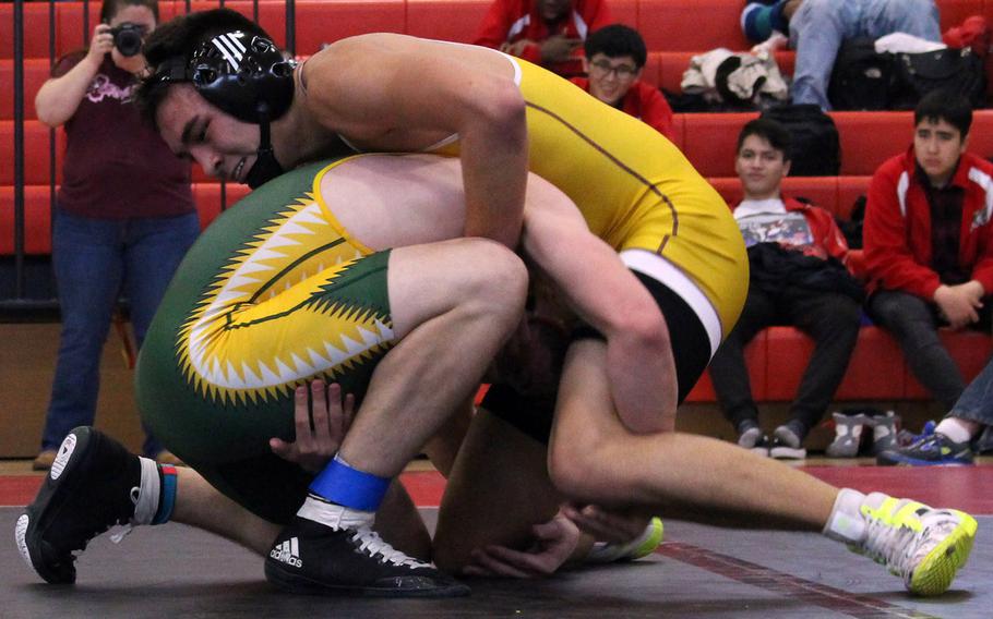 Matthew C. Perry's Mason Graydon gains the upper hand on Robert D. Edgren's Cody Guy in the 141-148-pound final bout during Saturday's Perry Invitational Tournament. Graydon won the bout and the weight class, while Guy took second.