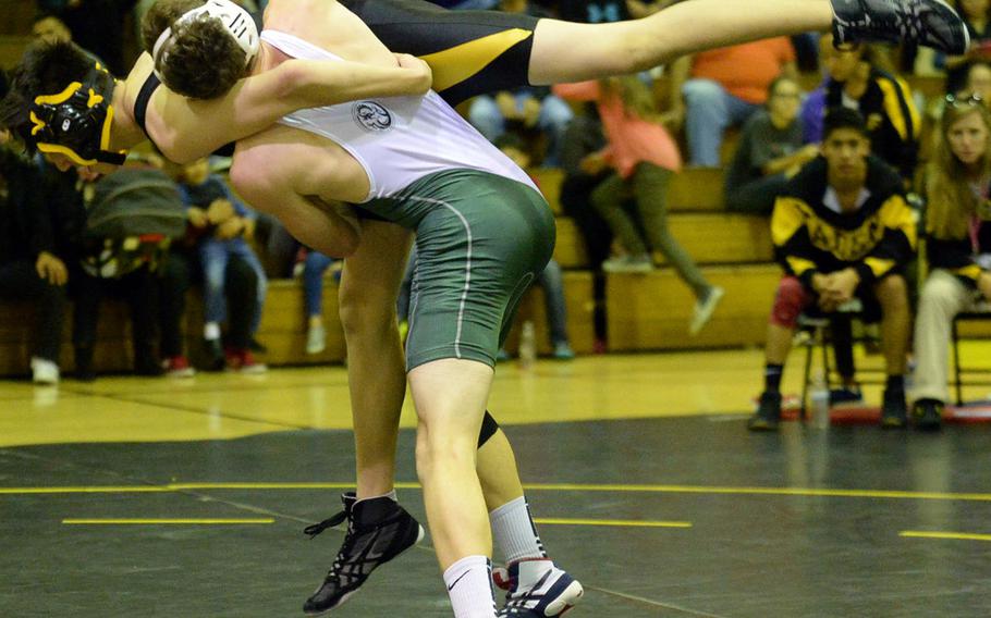 Kubasaki's Koby Karl throws Kadena's Bryce Ortiz in the 141-pound bout during Thursday's Okinawa wrestling dual meet. Karl won by technical fall 10-0 in 2 minutes, 7 seconds, and the Dragons won the dual meet 52-12 to sweep the season series.