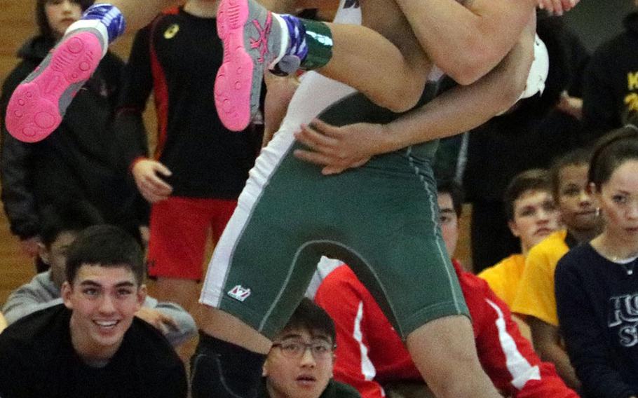 Kubasaki's Luis Veliz lifts to throw St. Mary's Harold Mancia in the 115-pound final during Friday's individual portion of the 41st Far East High School Wrestling Tournament. Veliz pinned Mancia in 4 minutes, 33 seconds.