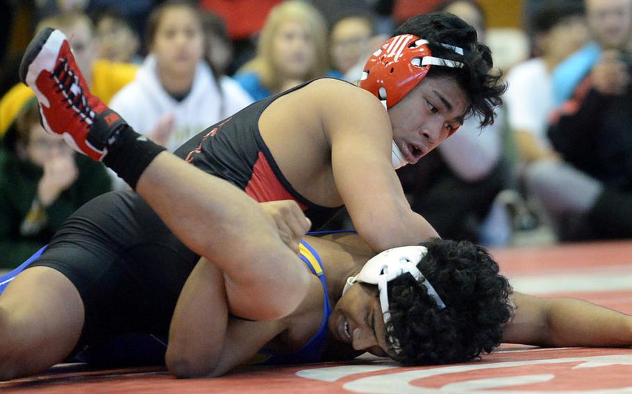 Nile C. Kinnick's Jacob Castro gains the advantage over St. Mary's Nishant Chanda n the 148-pound final during Friday's individual freestyle portion of the 41st Far East High School Wrestling Tournament. Castro won by technical fall 13-2 in 3 minutes.