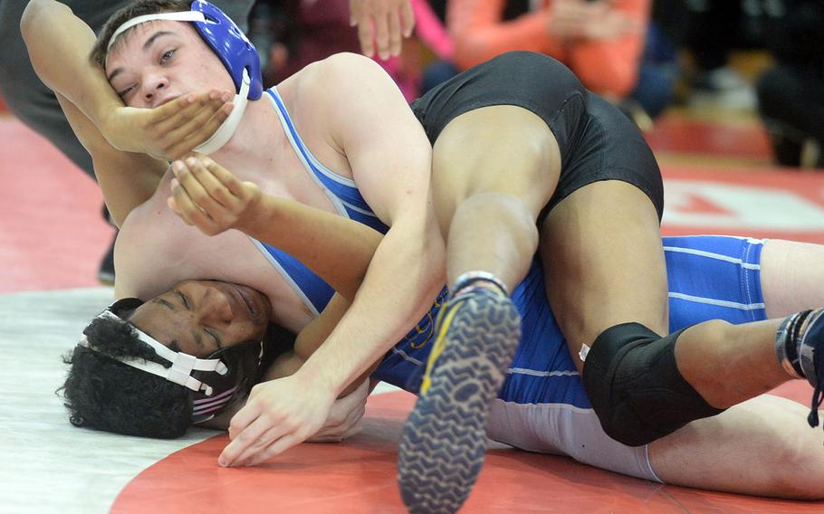 Yokota's Kyle Easterwood gets a head-and-arm hold on Matthew C. Perry's Bryan Williams at 135 pounds during Saturday's Far East Wrestling Tournament Division II dual-meet final. Easterwood rallied from a 14-9 deficit to pin Williams in 2 minutes, 55 seconds. Yokota won the meet 53-10.