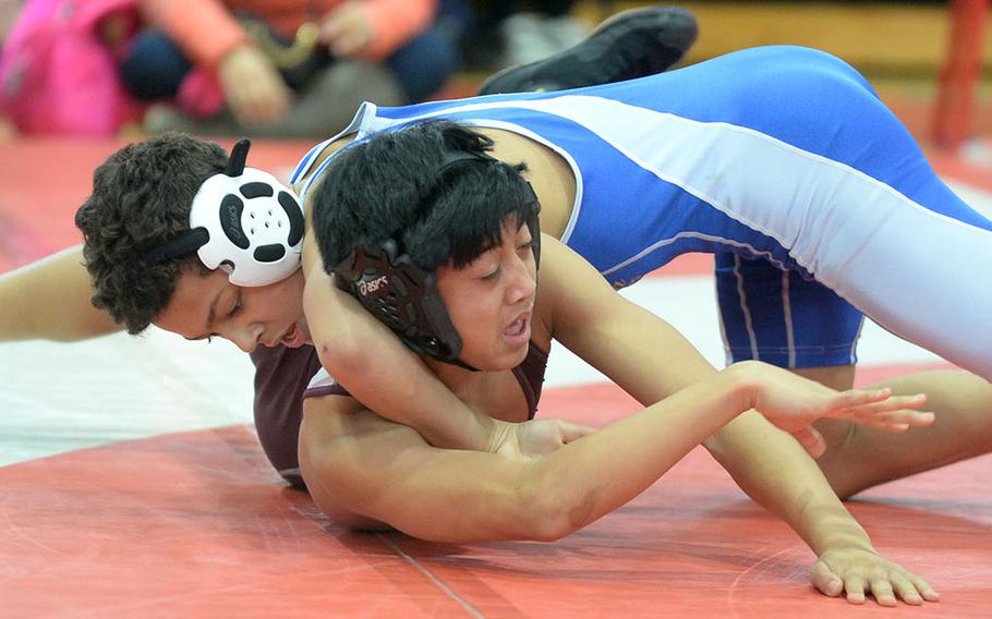 Yokota's Chris DeGrella gets the upper hand on Matthew C. Perry's Joel Pacleb at 108 pounds during Saturday's Far East Wrestling Tournament Division II dual-meet final. DeGrella pinned Pacleb in 3 minutes, 58 seconds. Yokota won the meet 53-10.