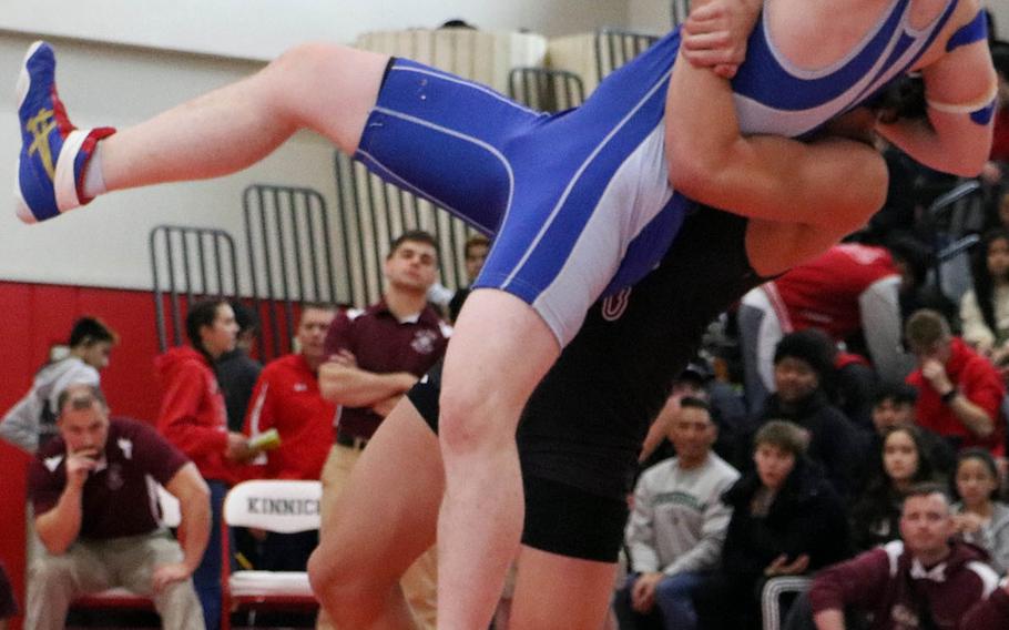 Matthew C. Perry's Mason Graydon throws Yokota's James O'Grady in the 148-pound bout during Saturday's Far East Wrestling Tournament Division II dual-meet final. Graydon injured his shoulder on the throw and O'Grady picked up the victory by default. Yokota won the dual meet 53-10.