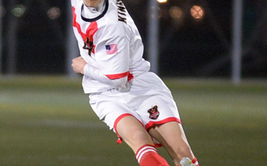 Nile C. Kinnick's Cael Bowen launches a kick from the back line against Robert D. Edgren during Friday's DODEA-Japan boys soccer match. The Red Devils blanked the Eagles 6-0.