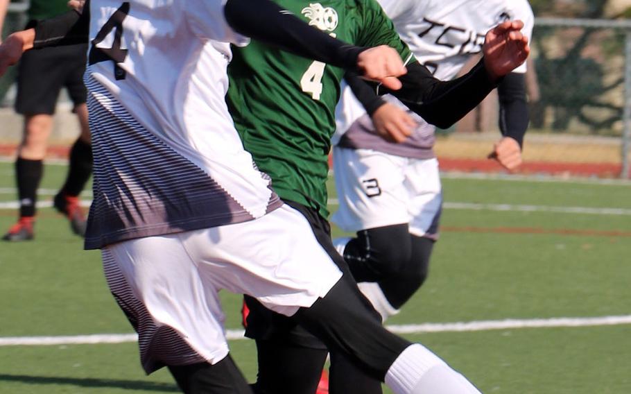 Daegu's Oscar Melendez and Taejon Christian's Yisoo Han battle for the ball during Saturday's Korea Blue boys soccer match, won by the Dragons 1-0 on an own goal.