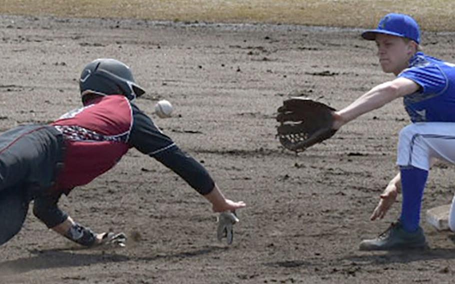 Matthew C. Perry baserunner Garrett Macias tries to slide back to second base ahead of a pickoff throw to Yokota shortstop Jack Winkler during Saturday's DODEA-Japan boys baseball game. Andres was safe on the play. The Panthers won 16-0.