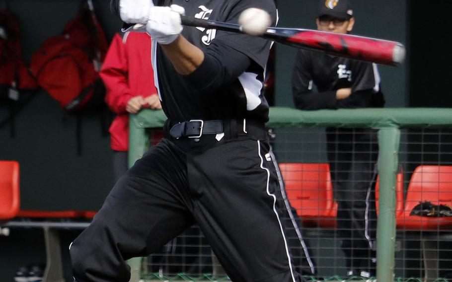 E.J. King's Eric Sasaki takes his cuts against Yokota during Saturday's DODEA-Japan baseball game. The Panthers won 14-3.