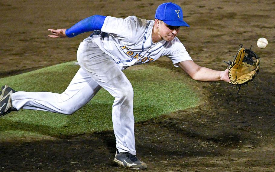 Yokota pitcher Jack Winkler tries to field a liner off a Nile C. Kinnick bat during Wednesday's DODEA-Japan/Kanto Plain baseball game, won by the Red Devils 10-6 in eight innings.