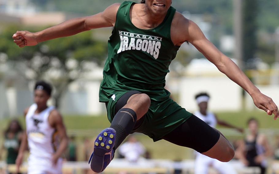 Kubasaki's Juan Guerrero clears the last hurdle en route to winning the 300 hurdles in 40.99 seconds during Friday's Mike Petty Memorial Track and Field Meet.