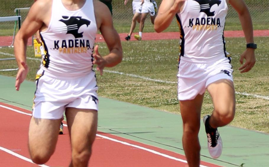 Michael Rutlege beats out Kadena teammate Hayden Bills to the finish line of the 800 meters during Friday's Mike Petty Memorial Track and Field Meet.