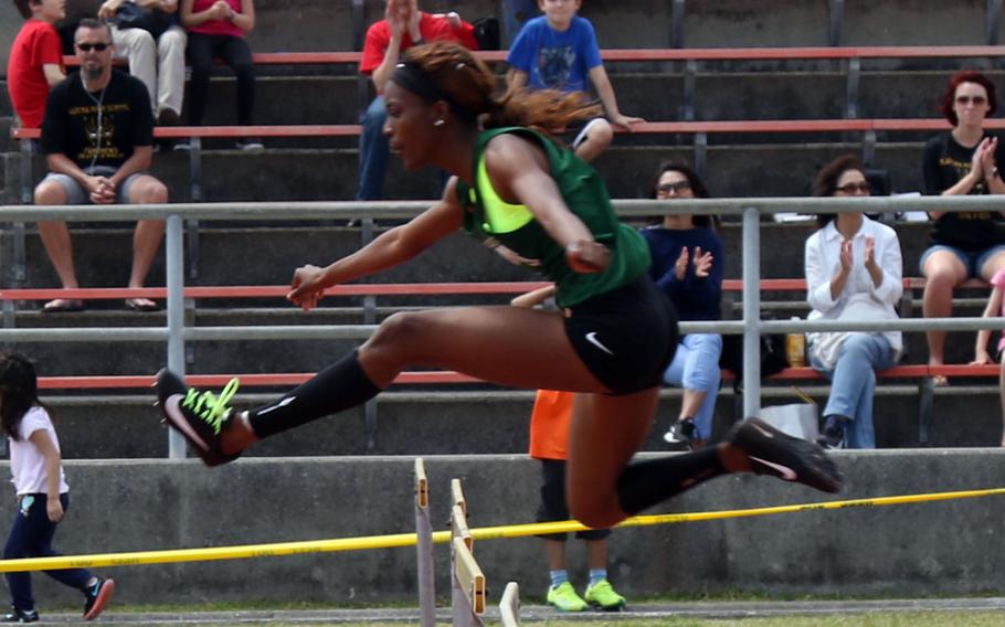Kubasaki's Ja'Tavia Callier negotiates a hurdle en route to completing the 300-meter hurdles event in 46.81 seconds, .2 seconds hy of the Pacific record. Callier won three events and took second in another during Friday's Mike Petty Memorial Track and Field Meet.