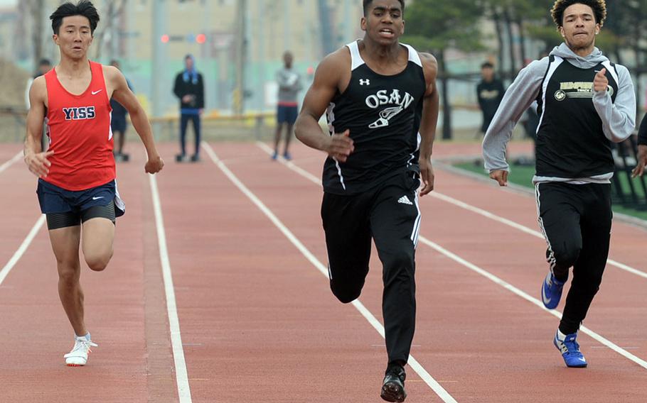 Osan's Cameron Jones heads toward the finish of the boys 100 dash during Saturday's truncated Korea track and field meet at Humphreys' Blackhawks Stadium. Jones won in 11.5 seconds on the stop watch. 