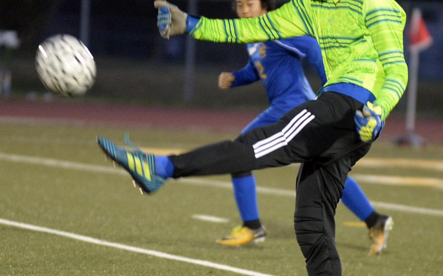 Yokota's Renyck Robertson lets loose with a goal kick against Robert D. Edgren. The teams played to a 1-1 draw in Friday's DODEA Japan boys soccer match.
