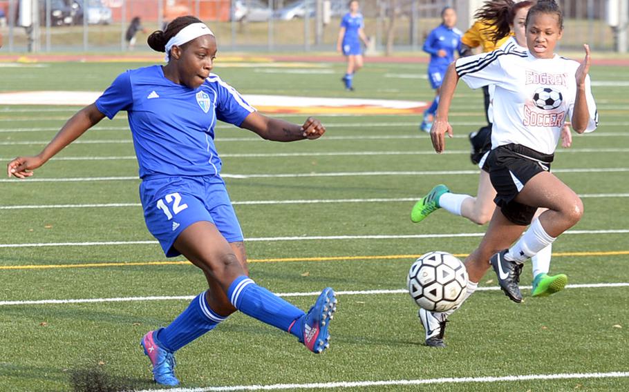 Yokota's Jamia Bailey fires a shot past two Robert D. Edgren defenders during Friday's DODEA Japan girls soccer match, won by the Panthers 4-0.