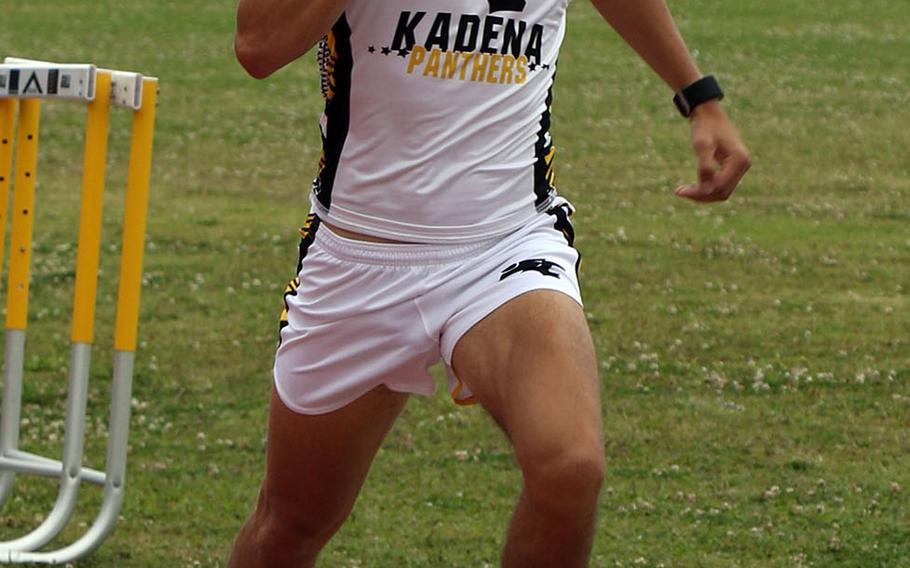 Kadena's Hayden Bills pounds for the finish to win the boys 1,600 during Saturday's Okinawa track and field meet at Kadena.