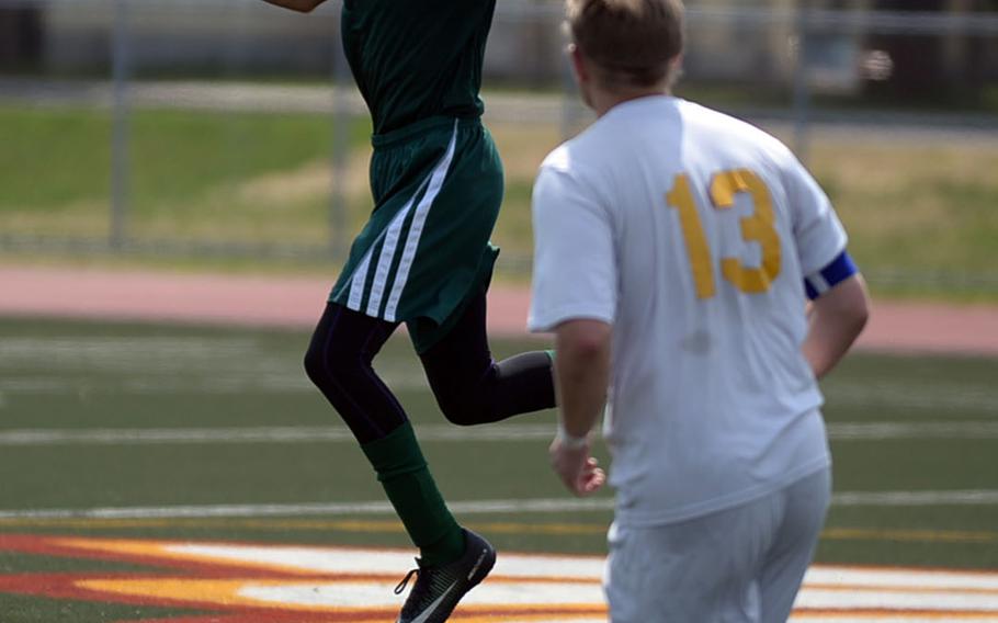 Robert D. Edgren's Jun Royster heads the ball in front of Yokota's Eli Newton during Saturday's DODEA-Japan boys soccer match, won by the Panthers 3-0.