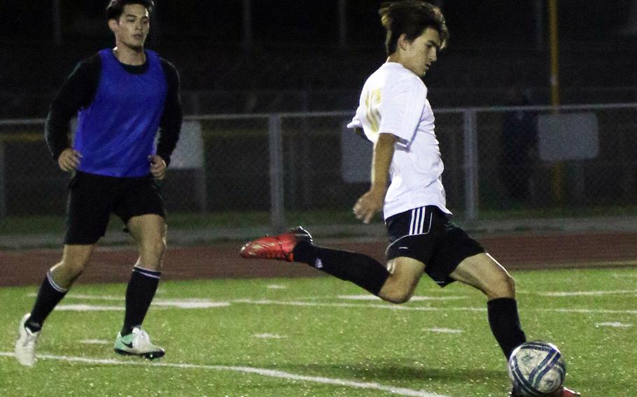 Kadena's Kian Smith lines up a shot against Military United during Wednesday's soccer match. Smith had all three Panthers goals and the teams played to a 3-3 draw.