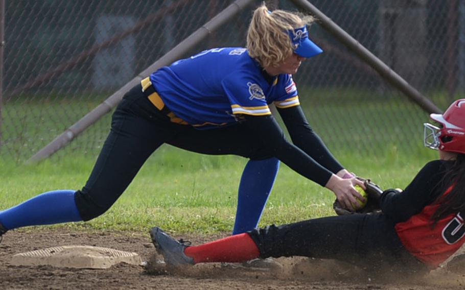 Yokota's Jordyn Logue tags out Nile C. Kinnick's Ashley Davies sliding into third base during Thursday's pool-play game in the DODEA-Japan softball tournament, won by the Panthers 7-4.
