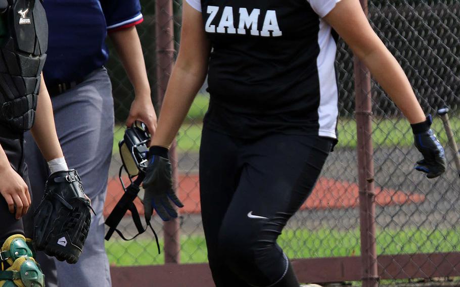 Jessica Atkinson of Zama shouts with joy as she crosses the plate, but in a losing effort, as Robert D. Edgren edged the Trojans 8-7 Thursday, Day 1 of the DODEA Japan softball tournament.