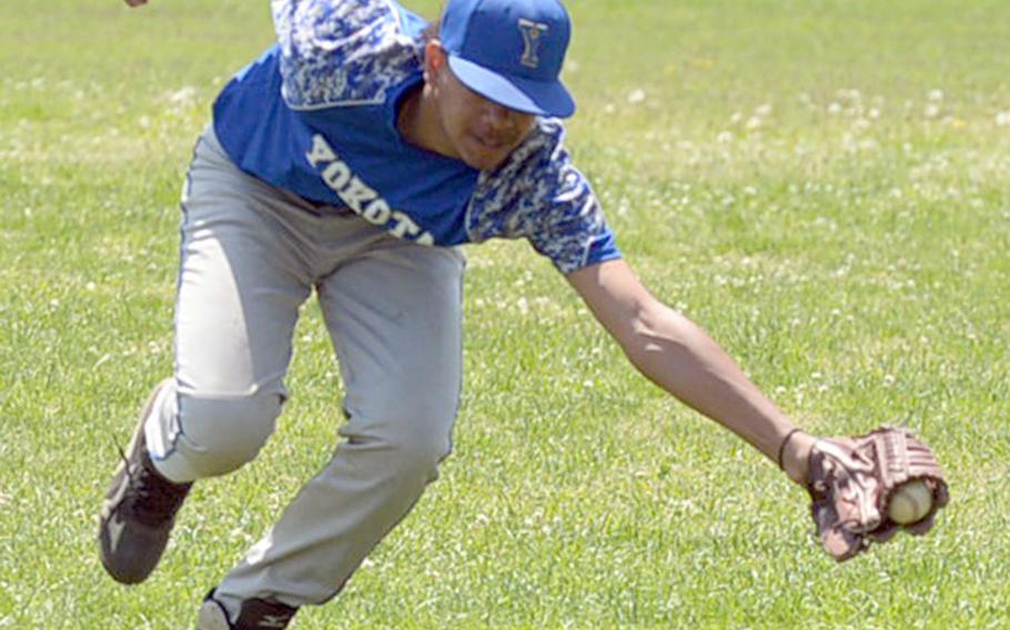 Yokota's Richard Stowe lunges and catches a line drive against Zama during Saturday's DODEA-Japan baseball tournament game. Yokota won 5-2 and finished the tournament 4-0, winning it for the third straight year.