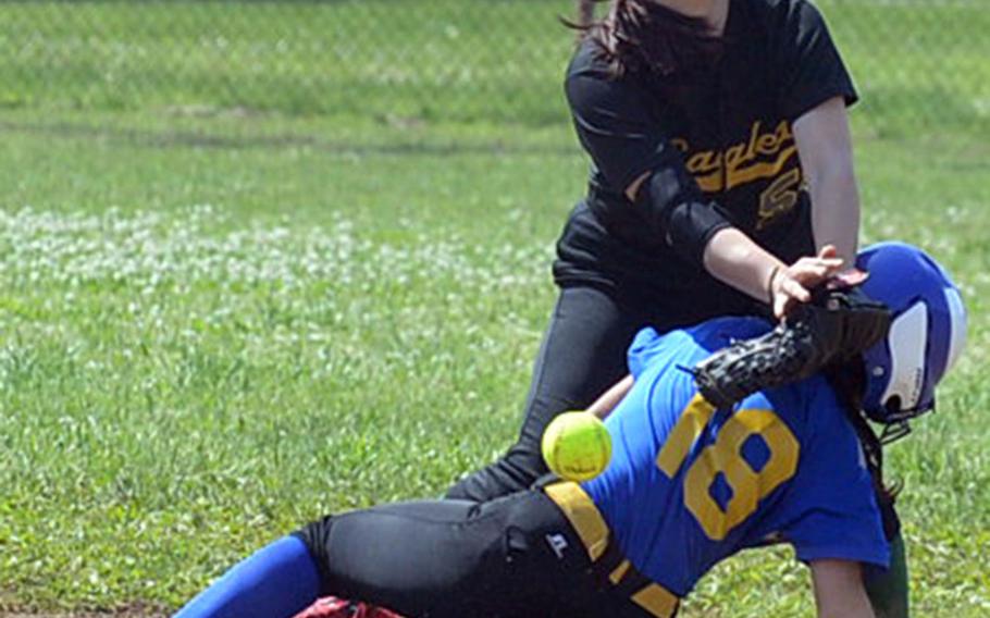 Yokota's Annalise Rodriguez slides safely into second base as Robert D. Edgren shortstop Veronica Crawford can't find the handle on the ball during Saturday's DODEA-Japan softball tournament finals. The Eagles rallied past the Panthers 13-12 to win the tournament for the first time in school history.