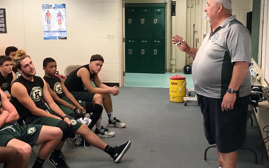Dragons 14th-year head coach Fred Bales makes his point during a chalk-talk session with his players.
