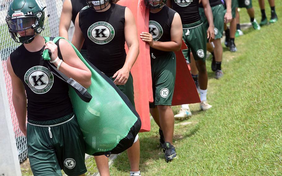 Kubasaki football players head out to the practice field on Monday, the opening day of official practices.