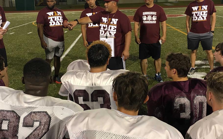 Coach Frank Macias, center, says the current Matthew C. Perry football crop reminds him much of the 2012 team that marked the program's reboot after a nine-season hiatus -- young, small and inexperienced players who are working hard, listening and coachable.