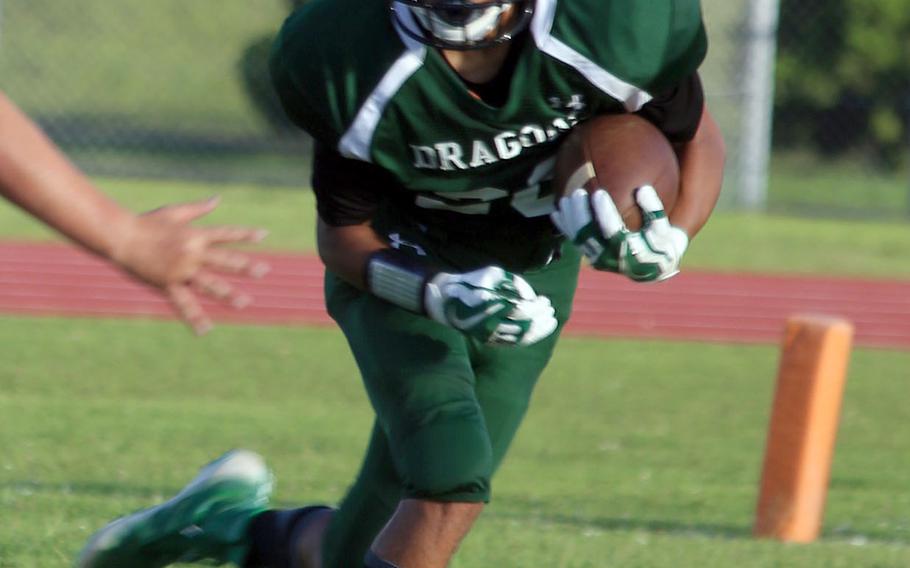 Kubasaki return man Keith Rascoe looks for running room against Kadena.